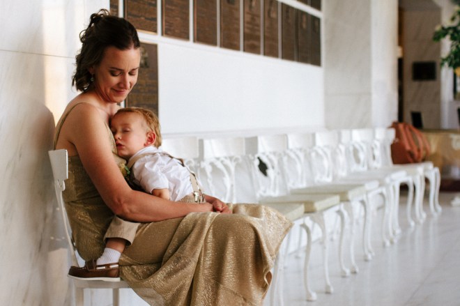 bridesmaid sits with her sleeping son-1