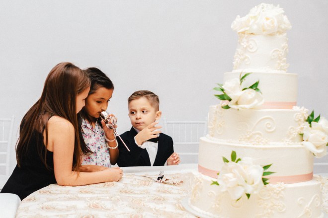 three kids waits for cake